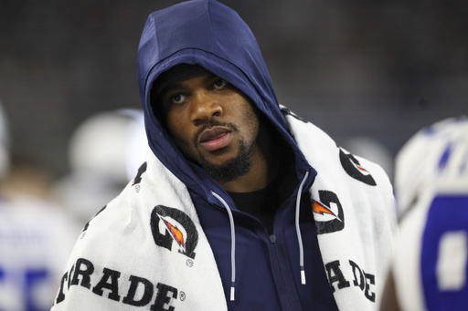 Dallas Cowboys defensive end Micah Parsons walks on the sideline during the second half of a preseason NFL football game against the Atlanta Falcons Friday, Aug. 22, 2025, in Arlington, Texas. (AP Photo/Gareth Patterson)