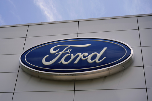 FILE - The Ford logo is seen above the entrance to the Ford Motor Company Kentucky Truck Plant, April 30, 2025, in Louisville, Ky. (AP Photo/Carolyn Kaster, File)