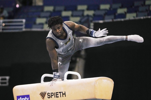 Frederick Richard of the University of Michigan competes on the pommel horse during the senior men's finals of the U.S. Gymnastics Championships in New Orleans, Saturday, Aug. 9, 2025. (AP Photo/Gerald Herbert)