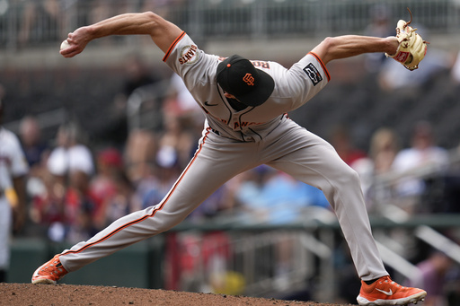 San Francisco Giants pitcher Tyler Rogers (71) delivers in the ninth inning of a baseball game against the Atlanta Braves, Wednesday, July 23, 2025, in Atlanta. (AP Photo/Mike Stewart)