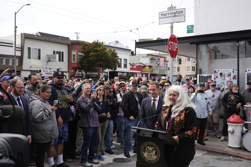 Trixie Garcia, daughter of musician Jerry Garcia, speaks during a ceremony to unveil the naming of Jerry Garcia Street, in honor of the Grateful Dead musician, Friday, Aug. 1, 2025, in San Francisco. (AP Photo/Godofredo A. Vásquez)