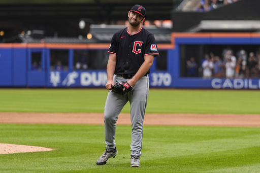 Cleveland Guardians pitcher Gavin Williams (32) reacts after giving up a hit during the ninth inning of a baseball game against the New York Mets, Wednesday, Aug. 6, 2025, in New York. (AP Photo/Yuki Iwamura)