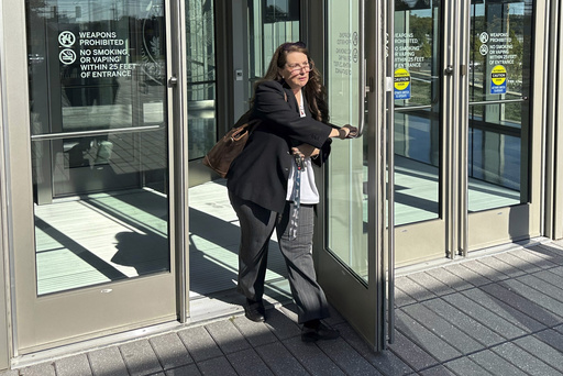 FILE - Heather Honey, a conservative election researcher, leaves the federal courthouse in Harrisburg, Pa., Oct. 18, 2024. (AP Photo/Mark Scolforo, File)