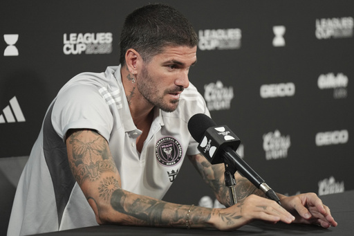 Rodrigo De Paul, Inter Miami's newest signing, addresses the media during an MLS soccer press conference, Friday, Aug. 1, 2025 in Fort Lauderdale, Fla. (AP Photo/Jim Rassol)