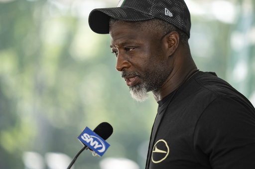 New York Jets head coach Aaron Glenn speaks at a press conference following practice at the team's NFL football training camp, Saturday, July 26, 2025, in Florham Park, N.J. (AP Photo/Angelina Katsanis)
