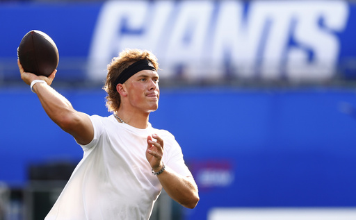 New York Giants quarterback Jaxson Dart warms up before a preseason NFL football game against the New York Jets in East Rutherford, N.J., Saturday, Aug. 16, 2025. (AP Photo/Noah K. Murray)