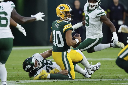 New York Jets' Jay Tufele sacks Green Bay Packers' Jordan Love during the first half of a preseason NFL football game Saturday, Aug. 9, 2025, in Green Bay, Wis. (AP Photo/Mike Roemer)