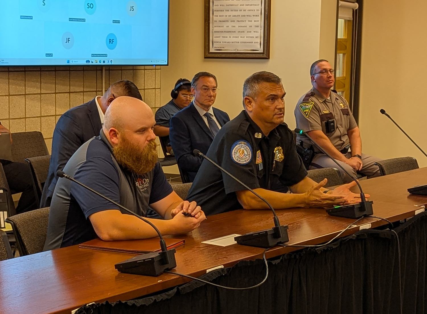Roberts County State's Attorney Dylan Kirchmeier, left, and Sisseton-Wahpeton Police Captain Gary Gaikowski speak to the State-Tribal Relations Committee on July 31, 2025 in Agency Village. (John Hult/South Dakota Searchlight)