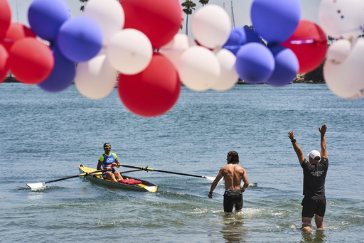 Athletes train at a beach sprints camp organized by USRowing in Long Beach, Calif., Sunday, Aug. 10, 2025. (AP Photo/Damian Dovarganes)
