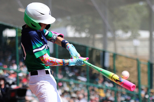 Bonney Lake, Wash,. Finn Harrington makes contact with a pitch against Las Vegas, Nev., during the first inning of a baseball game at the Little League World Series, Friday, Aug. 15, 2025, in South Williamsport, Pa. (AP Photo/Jared Freed)