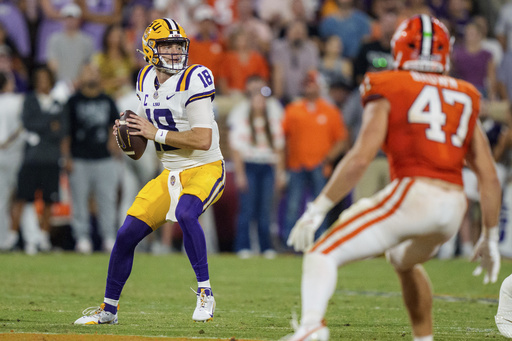 LSU quarterback Garrett Nussmeier (18) looks to pass in the first half of an NCAA college football game against Clemson Saturday, Aug. 30, 2025, in Clemson, S.C. (AP Photo/Jacob Kupferman)