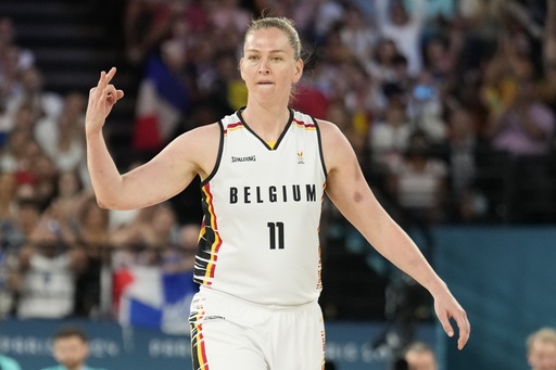 FILE - Emma Meesseman (11), of Belgium, reacts to a three pointer during a women's bronze medal basketball game at Bercy Arena at the 2024 Summer Olympics, Aug. 11, 2024, in Paris, France. (AP Photo/Mark J. Terrill, File)