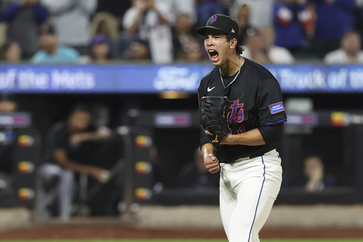 New York Mets pitcher Jonah Tong reacts after striking out Miami Marlins' Liam Hicks during the fifth inning of a baseball game Friday, Aug. 29, 2025, in New York. (AP Photo/Pamela Smith)
