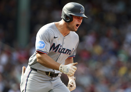 Miami Marlins' Jakob Marsee reacts after hitting a two-run home run in the ninth inning of a baseball game against the Boston Red Sox, Sunday, Aug. 17, 2025, in Boston. (AP Photo/Jim Davis)