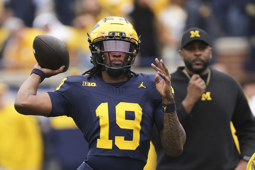 FILE - Michigan quarterback Bryce Underwood throws during an NCAA college football spring game in Ann Arbor, Mich., Saturday, April 19, 2025. (AP Photo/Paul Sancya)