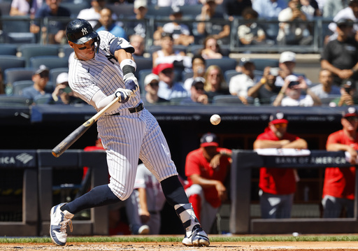 New York Yankees' Aaron Judge hits a two-run home run during the third inning of a baseball game against the Washington Nationals, Wednesday, Aug. 27, 2025, in New York. (AP Photo/Noah K. Murray)