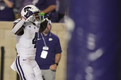 Kansas State running back Joe Jackson celebrates after scoring a touchdown during the second half of an NCAA college football game against North Dakota, Saturday, Aug. 30, 2025, in Manhattan, Kan. (AP Photo/Charlie Riedel)