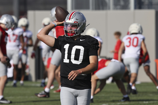 Ohio State quarterback Julian Sayin participates in a drill during NCAA college football practice in Columbus, Ohio, Friday, Aug. 1, 2025. (AP Photo/Paul Vernon)