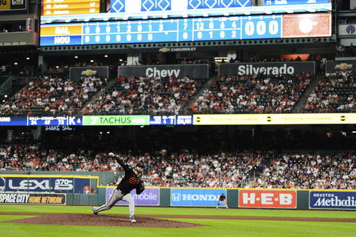 Baltimore Orioles starting pitcher Brandon Young throws during the eighth inning of a baseball game against the Houston Astros in Houston, Friday, Aug. 15, 2025. (AP Photo/Ashley Landis)