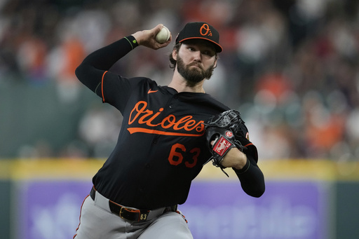 Baltimore Orioles starting pitcher Brandon Young throws during the first inning of a baseball game against the Houston Astros in Houston, Friday, Aug. 15, 2025. (AP Photo/Ashley Landis)