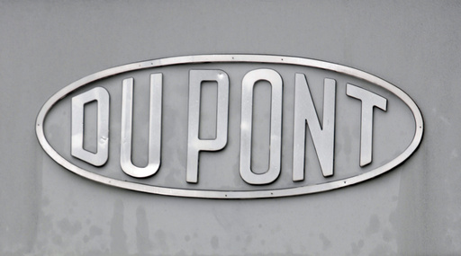 FILE - The DuPont logo is seen on a sign at the entrance to the company's Spruance Plant on April 22, 2008, in Richmond, Va. (AP Photo/Steve Helber, File)