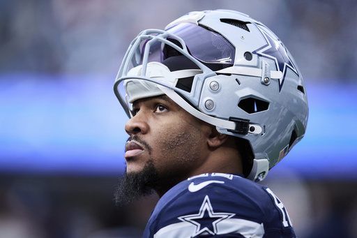 FILE - Dallas Cowboys linebacker Micah Parsons (11) walks on the sideline during an NFL football game against the Carolina Panthers, Sunday, Dec. 15, 2024, in Charlotte, N.C. (AP Photo/Brian Westerholt, File)