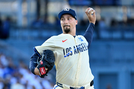 Los Angeles Dodgers pitcher Blake Snell throws against the San Diego Padres during the second inning of a baseball game Saturday, Aug. 16, 2025, in Los Angeles. (AP Photo/Wally Skalij)