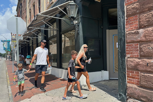 People stroll past Paula Deen's restaurant The Lady Sons in Savannah, Ga., on Friday, Aug. 1, 2025, after Deen announced the eatery that launched her to Food Network fame had closed. (AP Photo/Russ Bynum)