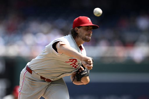 Philadelphia Phillies starting pitcher Aaron Nola throws during the first inning of a baseball game against the Washington Nationals, Sunday, Aug. 17, 2025, in Washington. (AP Photo/Nick Wass)
