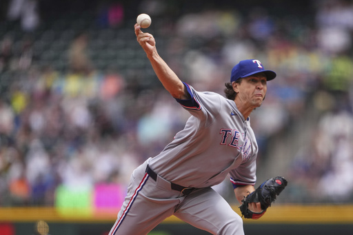 Texas Rangers starting pitcher Jacob deGrom throws against the Seattle Mariners during the first inning of a baseball game Sunday, Aug. 3, 2025, in Seattle. (AP Photo/Lindsey Wasson)