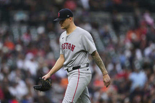 FILE - Boston Red Sox pitcher Tanner Houck walks to the dugout after being pulled against the Detroit Tigers in the third inning during a baseball game, May 12, 2025, in Detroit. (AP Photo/Paul Sancya, File)