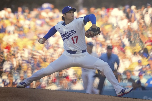 Los Angeles Dodgers designated hitter Shohei Ohtani throws to the plate during the first inning of a baseball game against the Cincinnati Reds, Wednesday, Aug. 27, 2025, in Los Angeles. (AP Photo/Mark J. Terrill)