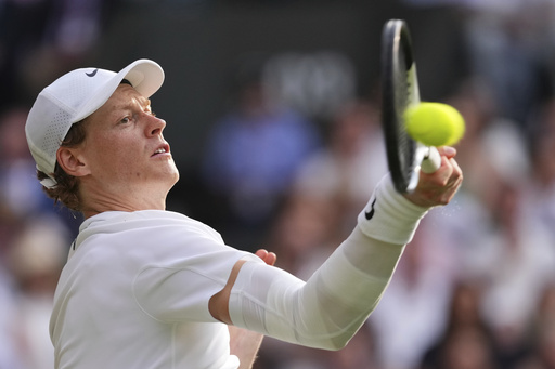 FILE - Jannik Sinner of Italy plays a return to Carlos Alcaraz of Spain during the men's singles final match at the Wimbledon Tennis Championships in London, Sunday, July 13, 2025.(AP Photo/Kirsty Wigglesworth, file)