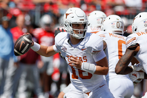Texas quarterback Arch Manning drops back to pass against Ohio State during the first half of an NCAA college football game, Saturday, Aug. 30, 2025, in Columbus, Ohio. (AP Photo/Jay LaPrete)