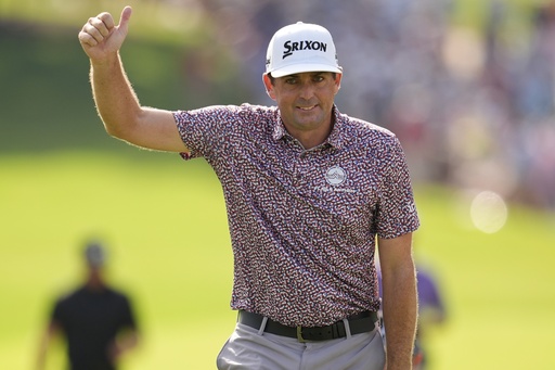 Keegan Bradley walks to the 18th green during the final round of the Tour Championship golf tournament, Sunday, Aug. 24, 2025, in Atlanta. (AP Photo/Mike Stewart)