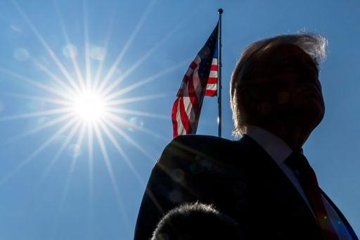 President Donald Trump speaks with reporters before departing on Marine One from the South Lawn of the White House, Friday, July 25, 2025, in Washington. The President is traveling to Scotland. (AP Photo/Alex Brandon)