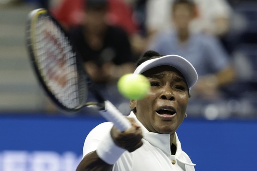 Venus Williams, of the United States, returns a shot to Karolina Muchova, of the Czech Republic, during the first round of the U.S. Open tennis championships, Monday, Aug. 25, 2025, in New York. (AP Photo/Adam Hunger)