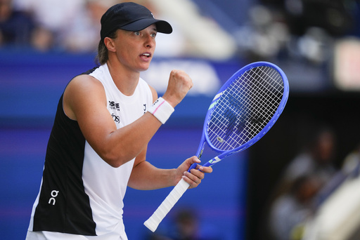 Iga Swiatek, of Poland, reacts after scoring a point against Emiliana Arango, of Colombia, during the first round of the US Open tennis championships, Tuesday, Aug. 26, 2025, in New York. (AP Photo/Yuki Iwamura)