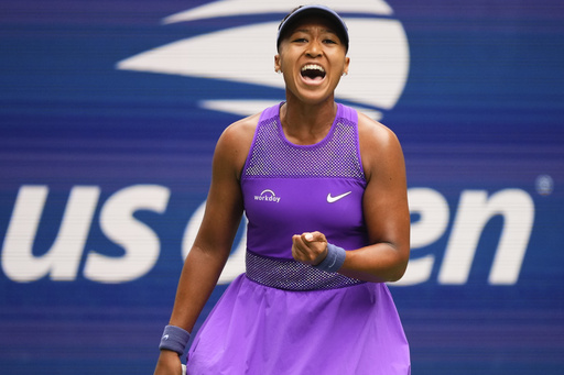 Naomi Osaka, of Japan, reacts after scoring a point against Hailey Baptiste, of the United States, during the second round of the U.S. Open tennis championships, Thursday, Aug. 28, 2025, in New York. (AP Photo/Yuki Iwamura)