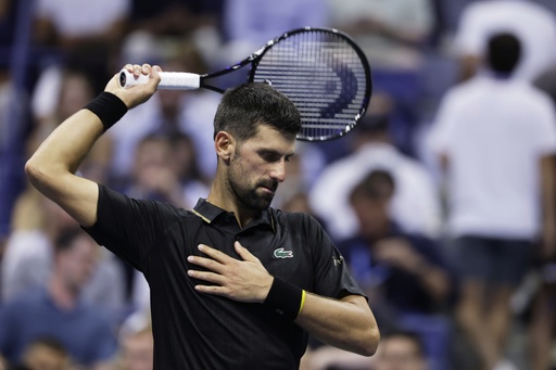 Novak Djokovic, of Serbia, stretches against Cameron Norrie, of Great Britain, during the third round of the U.S . Open tennis championships, Friday, Aug. 29, 2025, in New York. (AP Photo/Adam Hunger)
