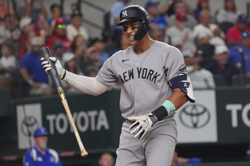 New York Yankees' Aaron Judge reacts to striking out during the fourth inning of a baseball game against the Texas Rangers, Tuesday, Aug. 5, 2025, in Arlington, Texas. (AP Photo/LM Otero)