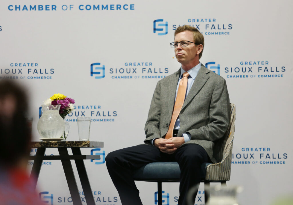 U.S. Rep. Dusty Johnson, R-South Dakota, speaks to the Greater Sioux Falls Chamber of Commerce on Aug. 22, 2025, in Sioux Falls. (Makenzie Huber/South Dakota Searchlight)