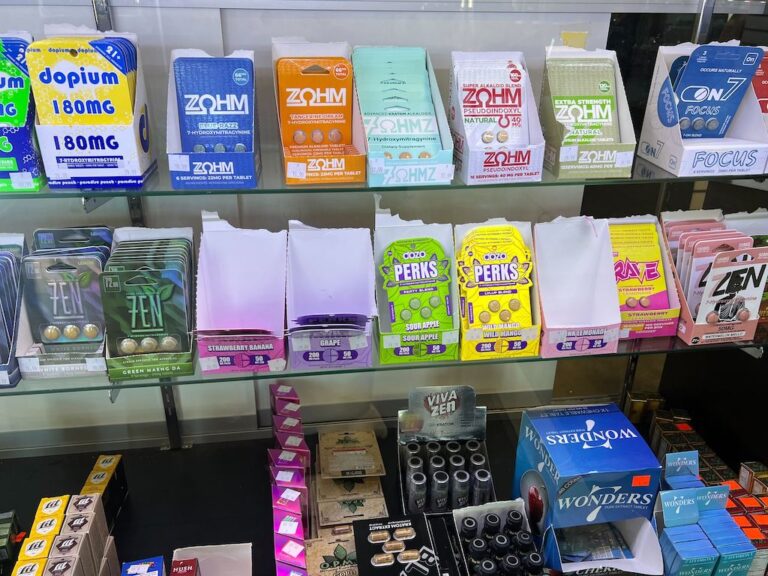 A variety of kratom and 7-OH products — including capsules, cartridges and wellness shots — are on display at a smoke shop in Buffalo, N.Y. (Photo by Amanda Hernández/Stateline)