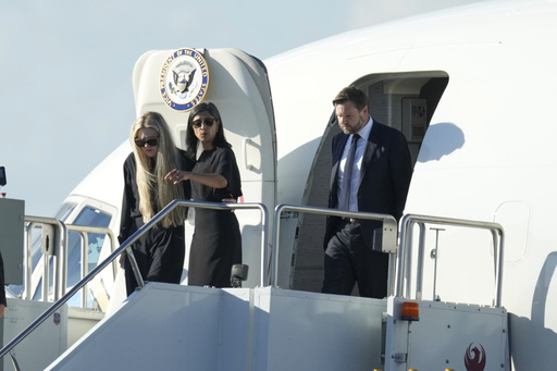 Vice President JD Vance, right, Second Lady Usha Vance, center, and Erika Kirk deplane Air Force Two, carrying the body of Charlie Kirk, the CEO and co-founder of Turning Point USA who was shot and killed, after landing at Phoenix Sky Harbor International Airport, Thursday, Sept. 11, 2025, in Phoenix. (AP Photo/Ross D. Franklin)