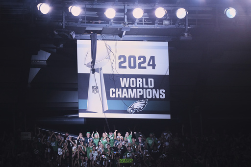 The Philadelphia Eagles 2024 championship banner is unveiled before an NFL football game against the Dallas Cowboys Thursday, Sept. 4, 2025, in Philadelphia. (AP Photo/Matt Slocum)