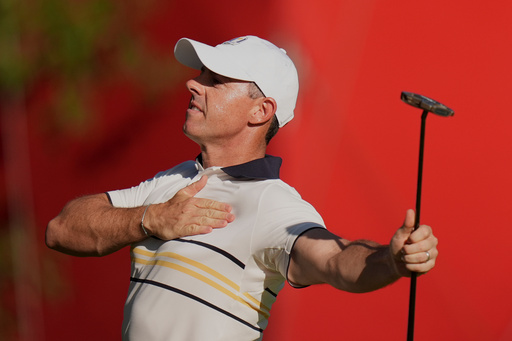 Europe's Rory McIlroy celebrates after a putt on the 15th hole during their singles match on the Bethpage Black golf course at the Ryder Cup golf tournament, Sunday, Sept. 28, 2025, in Farmingdale, N.Y. (AP Photo/Seth Wenig)