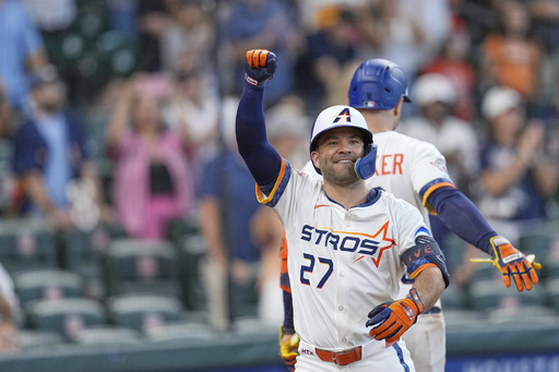 Houston Astros' Jose Altuve (27) celebrates after hitting a two-run home run against the Los Angeles Angels during the eighth inning of a baseball game Monday, Sept. 1, 2025, in Houston. (AP Photo/David J. Phillip)