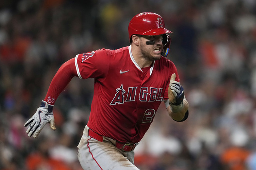 Los Angeles Angels designated hitter Mike Trout runs to first as he grounds out during the third inning of a baseball game against the Houston Astros in Houston, Sunday, Aug. 31, 2025. (AP Photo/Ashley Landis)