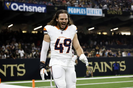FILE - Denver Broncos linebacker Alex Singleton (49) warms up before an NFL preseason football game against the New Orleans Saints in New Orleans, Aug. 23, 2024. (AP Photo/Tyler Kaufman, File)