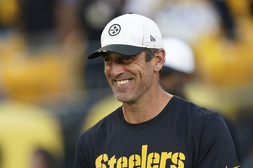 Pittsburgh Steelers quarterback Aaron Rodgers stands on the sidelines during the first half of an NFL football preseason game against the Tampa Bay Buccaneer,s Saturday, Aug. 16, 2025 in Pittsburgh. (AP Photo/Matt Freed)